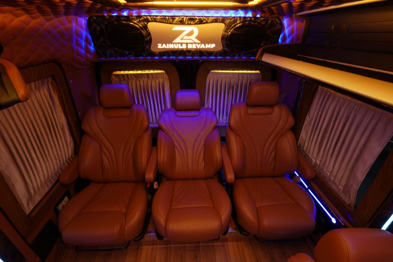 Luxury Force Urbania interior with brown leather captain seats and ambient lighting