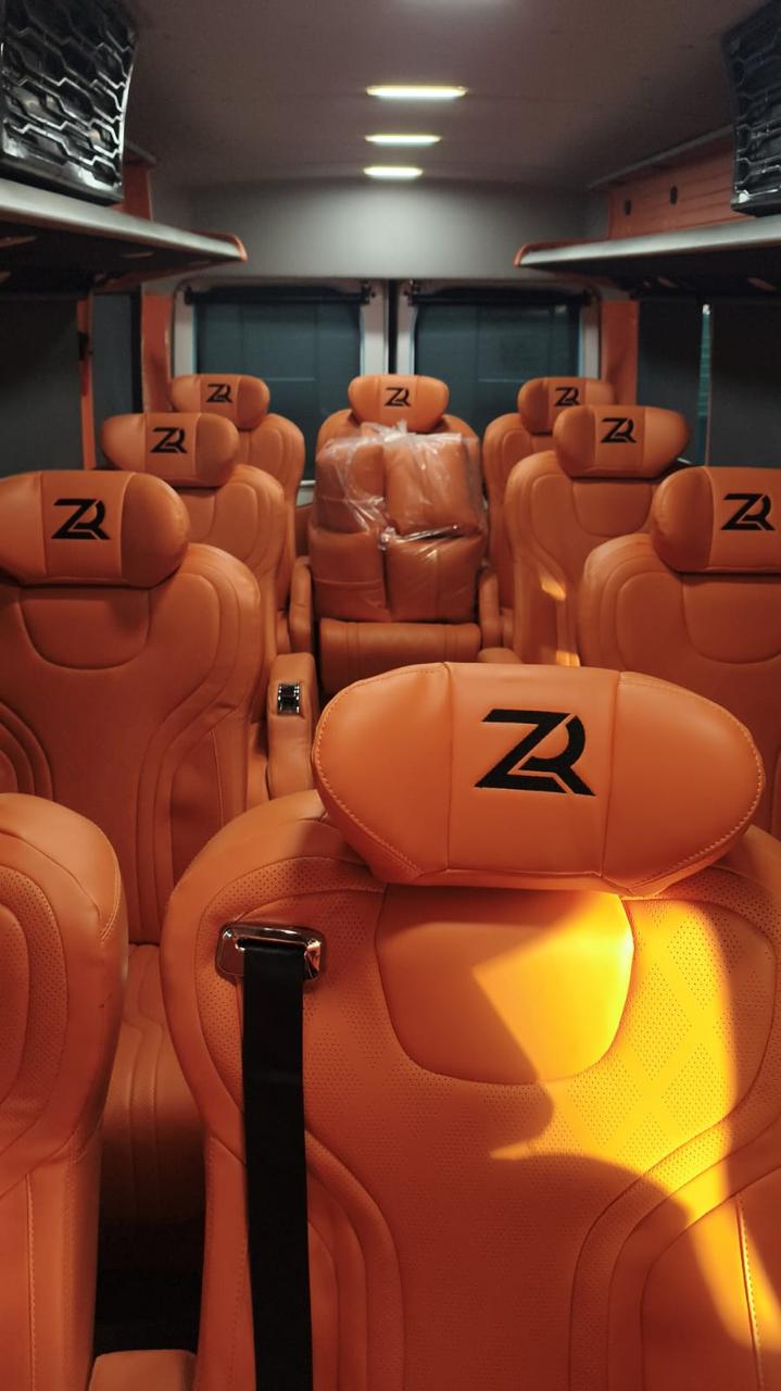 10-seater luxury Urbania with tan leather captain recliner seats